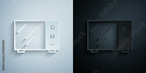 Paper cut Microwave oven icon isolated on grey and black background. Home appliances icon. Paper art style. Vector