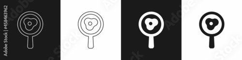 Set Fried eggs on frying pan icon isolated on black and white background. Fry or roast food symbol. Vector
