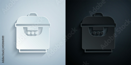 Paper cut Slow cooker icon isolated on grey and black background. Electric pan. Paper art style. Vector