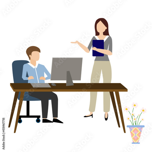 A man working sitting on chair using laptop and a lady standing talking about work 