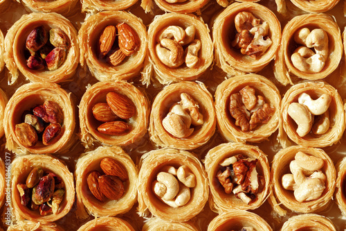 Background of traditional arabic dessert Baklava with honey and nuts