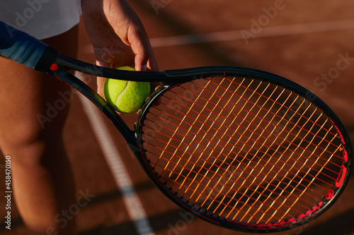 Crop sportswoman with tennis racket and ball © kegfire