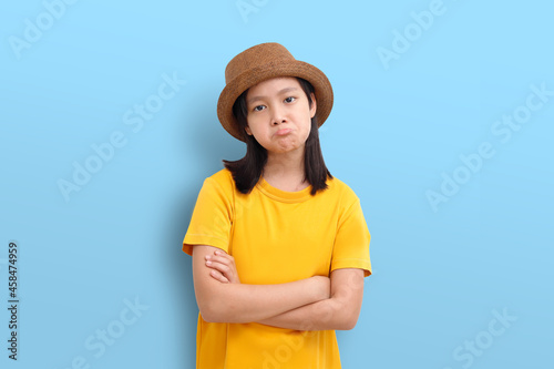 Canvas Print An Asian girl's sulky face posts emotions
