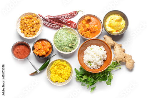 Traditional Indian food and spices on white background