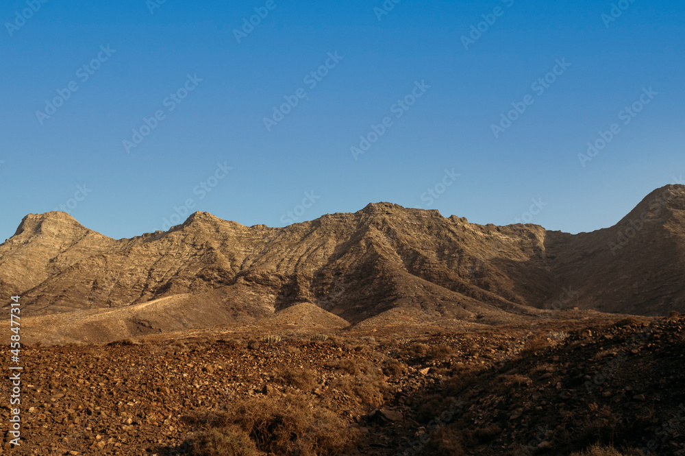 Rocky hills under sunset sky