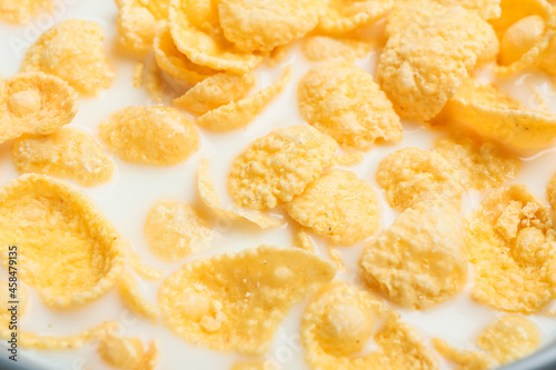 Tasty cornflakes with milk, closeup