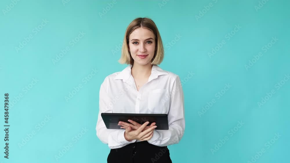 Business tablet. Internet network. Digital work. Elegant classy confident woman employee typing feedback on portable computer swipe up sending email isolated on blue copy space. Business tablet. Internet network. Digital work. Elegant classy confident woman employee typing feedback on portable computer swipe up sending email isolated on blue copy space.