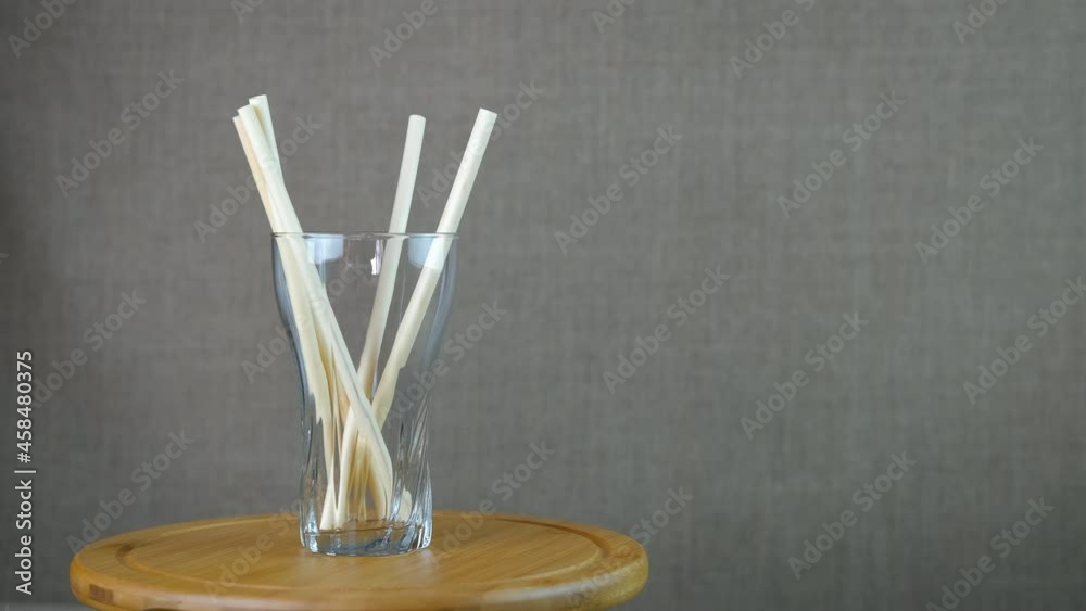 Natural materials for drinking. Glass tumbler with bio-halide reusable drinking straws. Natural materials for drinking. Glass tumbler with bio-halide reusable drinking straws.