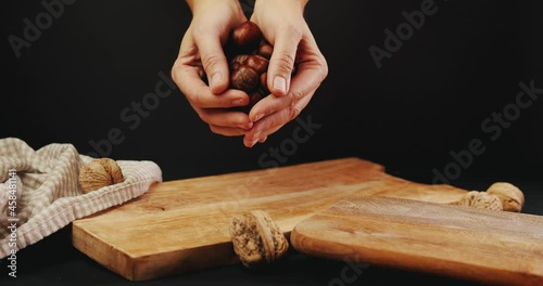 Dropping chestnuts from hands in slow motion