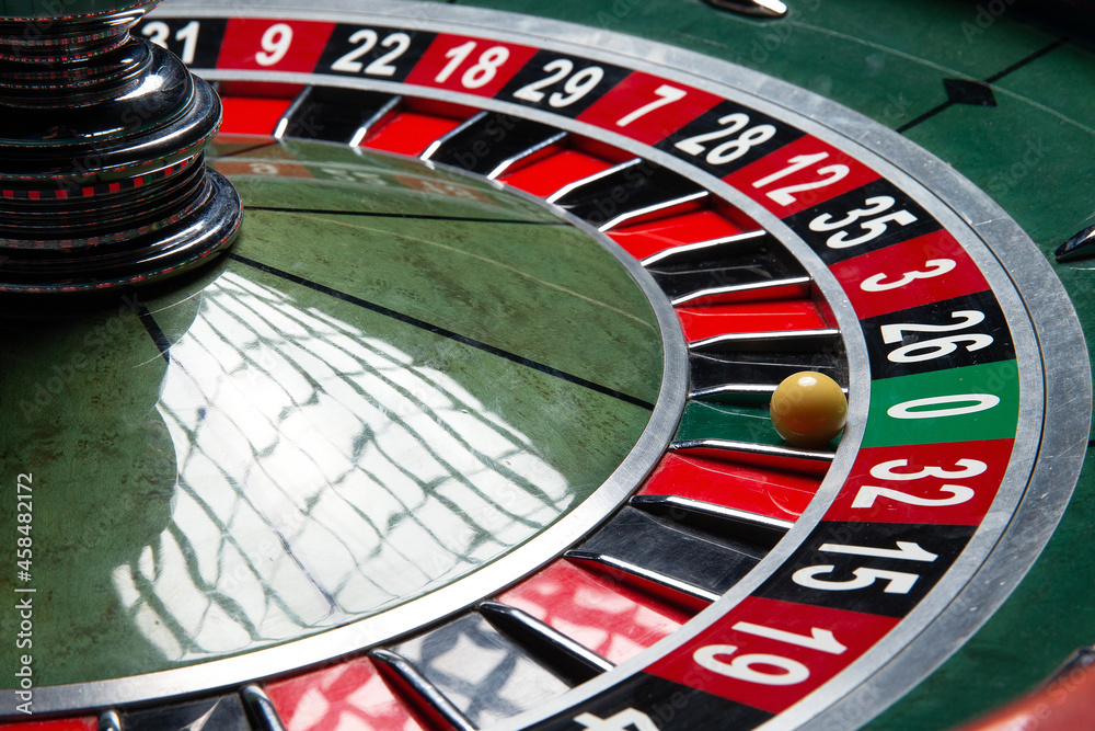 Casino Roulette Wheel. Ball in number zero. Close-up. Casino Roulette Wheel. Ball in number zero. Close-up.