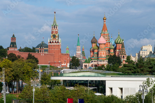 Fototapeta Naklejka Na Ścianę i Meble -  Cityscape of Moscow city downtown district. Moscow Kremlin with Spasskaya Tower and St. Basil's Cathedral rises above Zaryadye park. Russian architecture theme.