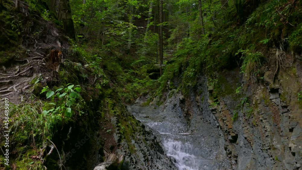 Beautiful mountain river. Landscape and stream of clear water. Mountain stream between the rocks. Beautiful mountain river. Landscape and stream of clear water. Mountain stream between the rocks.