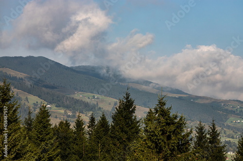 mountain slopes in the Ukrainian Carpathians. mountain tops and forests on a background of blue sky