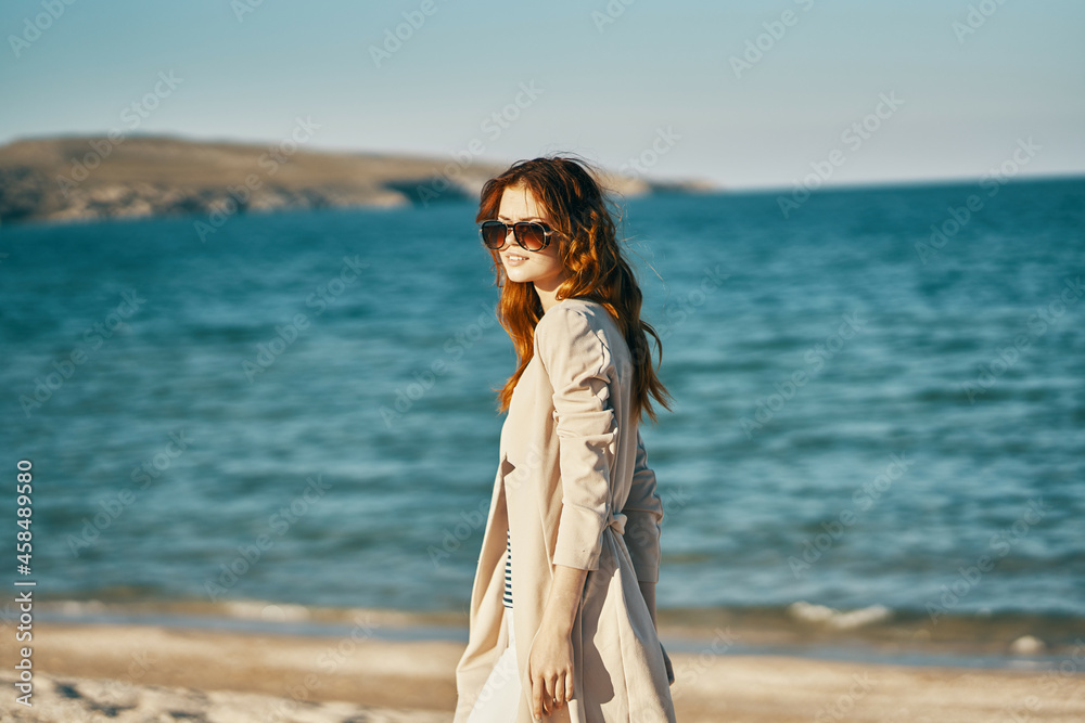 woman in sunglasses in summer outdoors on the beach sea travel woman in sunglasses in summer outdoors on the beach sea travel