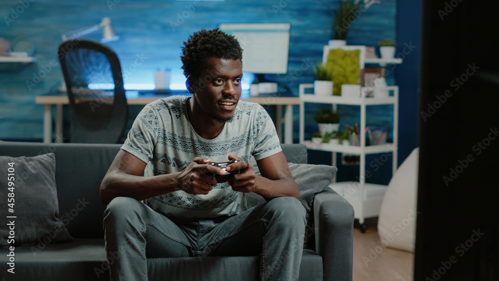 Having Fun at Home. Cheerful Black Teen Guy with Joystick Playing Online  Computer Games, Sitting on Couch Indoors Stock Image - Image of computer,  person: 227478857