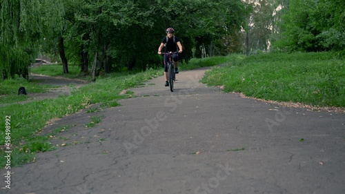 Wallpaper Mural Young woman riding bicycle for health in evening at public park. Girl rides a bike. Torontodigital.ca
