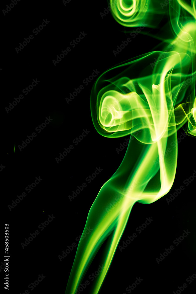 Fototapeta premium Green smoke on black background.