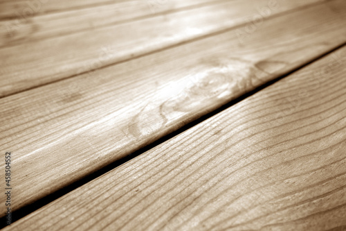 Wooden pine board surface in brown tone.