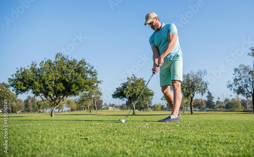 summer activity. professional sport outdoor. male golf player on professional golf course