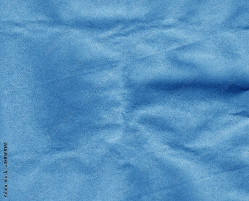 Fototapeta premium Crafted crumpled paper for background and desing in navy blue tone.