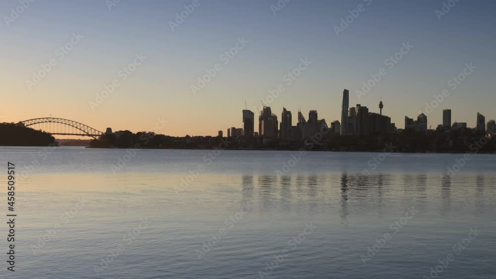 Sun rising over Sydney city skyline horizon across Harbour Inner West as 4k.
Sun rising over Sydney city skyline horizon across Harbour Inner West as 4k.