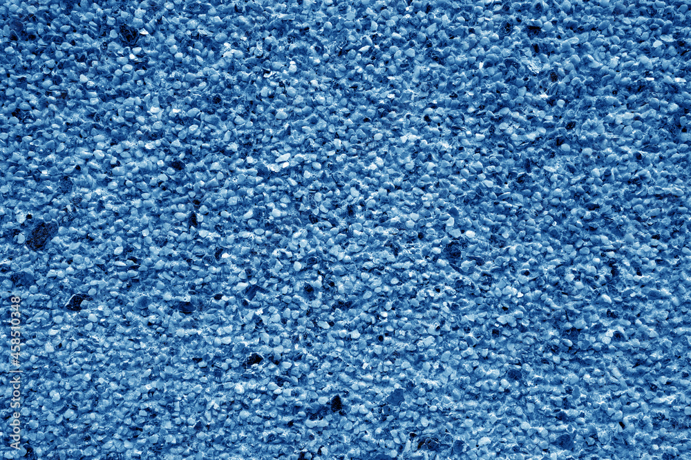 Wall covered with small stones in navy blue tone. Wall covered with small stones in navy blue tone.