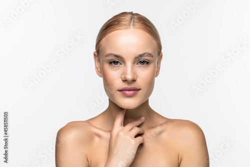 Beautiful young girl with a light natural make-up and perfect skin. Beauty face on a white background.