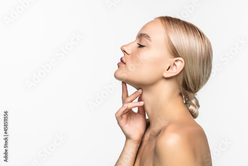 Beautiful young girl touching her face. Youth and skin care concept. Skin care