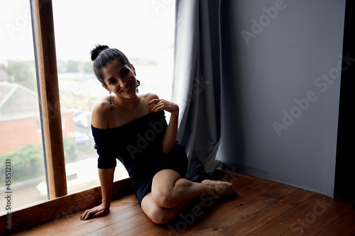 beautiful woman holding a camera near the window decoration fashion elegant style