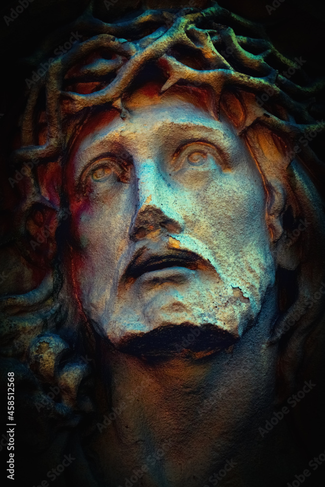 Suffering of Jesus Christ. An antique statue. Vertical image.