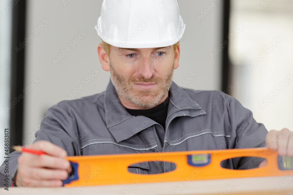 Fototapeta premium concentrated builder keeping special tool