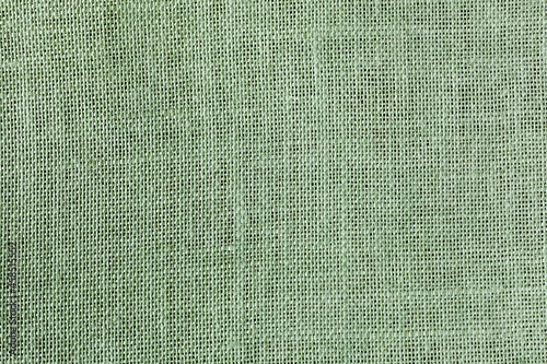 Jute fabric simple woven texture may used as background natural decorative fabric green clolor photo