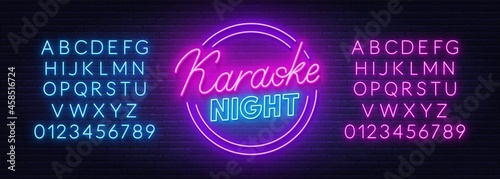 Karaoke night neon sign on brick wall background.