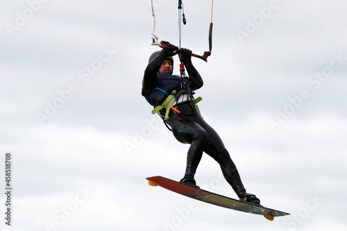 Kiter man jumping in sky