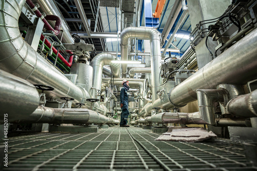 Photos Male to be worker visual inspection inside control room