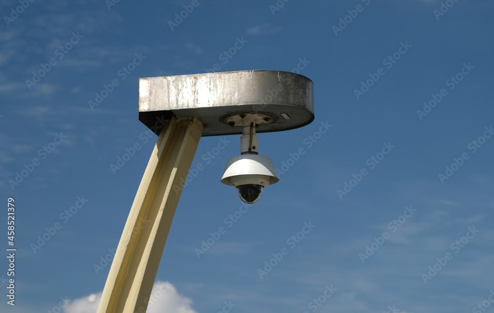 Real time Modern Online Security Panoramic CCTV camera surveillance system. An outdoor video surveillance ip-camera is installed on a metal post. Equipment system service for safety life or asset. Real time Modern Online Security Panoramic CCTV camera surveillance system. An outdoor video surveillance ip-camera is installed on a metal post. Equipment system service for safety life or asset.