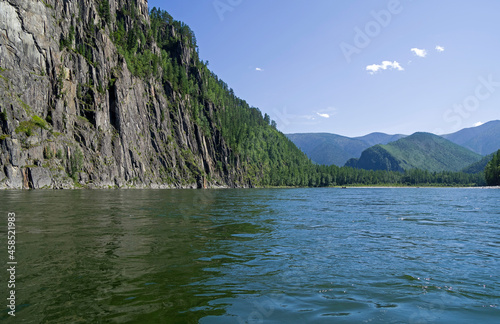 High steep rocky bank of a river. photo