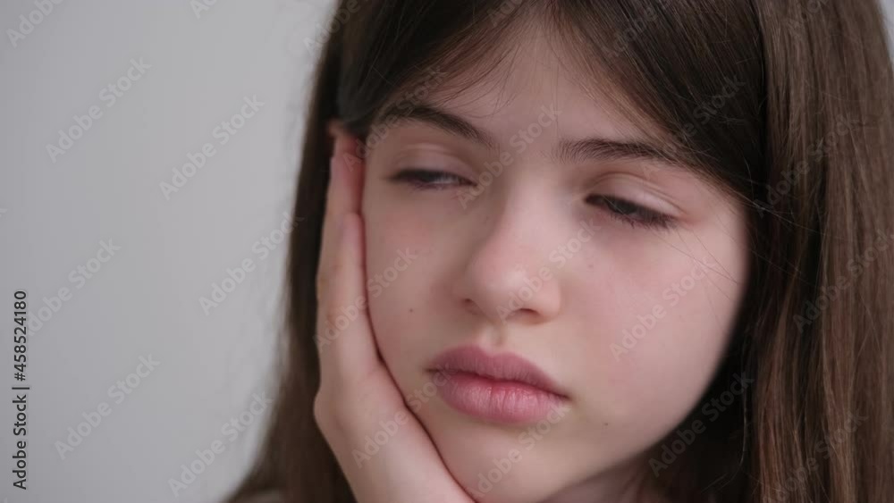 portrait of a sad beautiful girl with blue eyes , teen crying, holding his head portrait of a sad beautiful girl with blue eyes , teen crying, holding his head