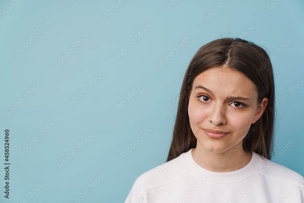 Young white brunette woman frowning and looking at camera Young white brunette woman frowning and looking at camera
