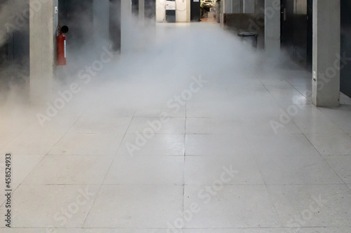 Wallpaper Mural Dissipating cloud of nitrogen gas floating low inside building corridor Torontodigital.ca