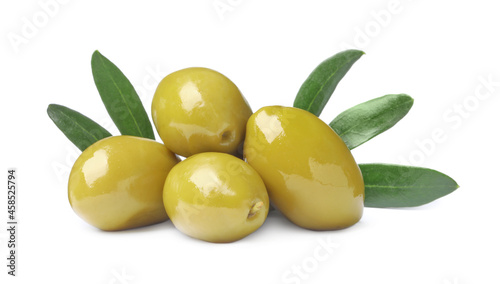 Delicious fresh green olives with leaves on white background