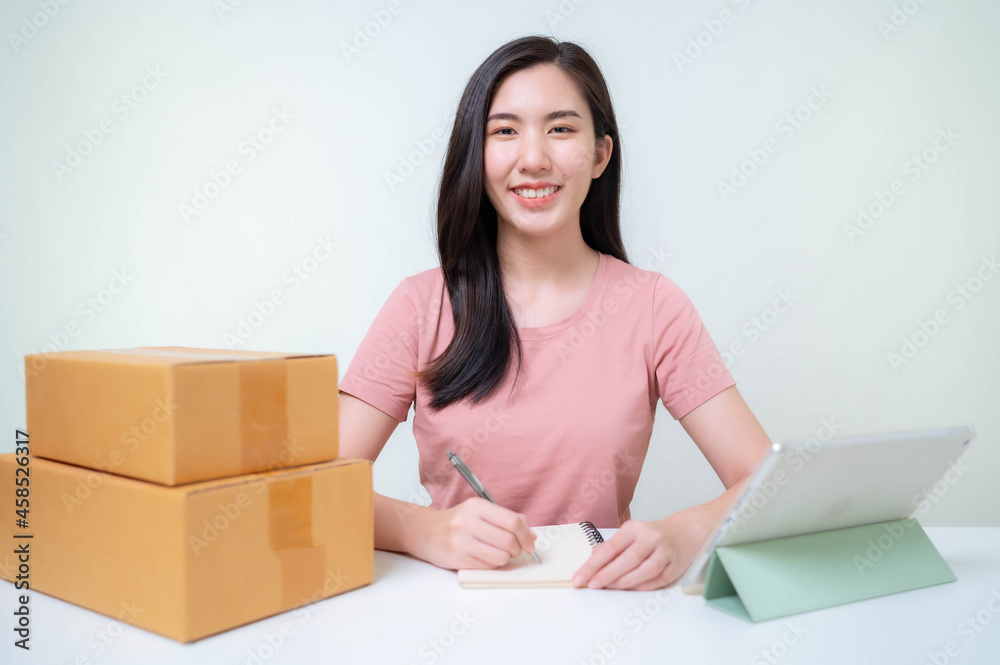 Asia woman Start up for Business Online. People with online shopping SME entrepreneur or freelance working concept. Banner size Asia woman Start up for Business Online. People with online shopping SME entrepreneur or freelance working concept. Banner size