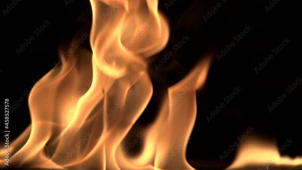 Natural red-orange flames on a black background. Natural red-orange flames on a black background.