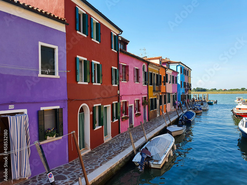 Colourful houses on a canal in Burano, Venice, Italy