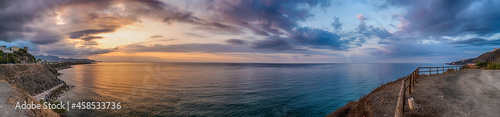 Sunset over Adriatic Sea with golden dramatic sky panorama. Solaris