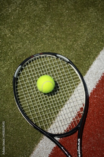 Tennis racket and tennis ball on sport court