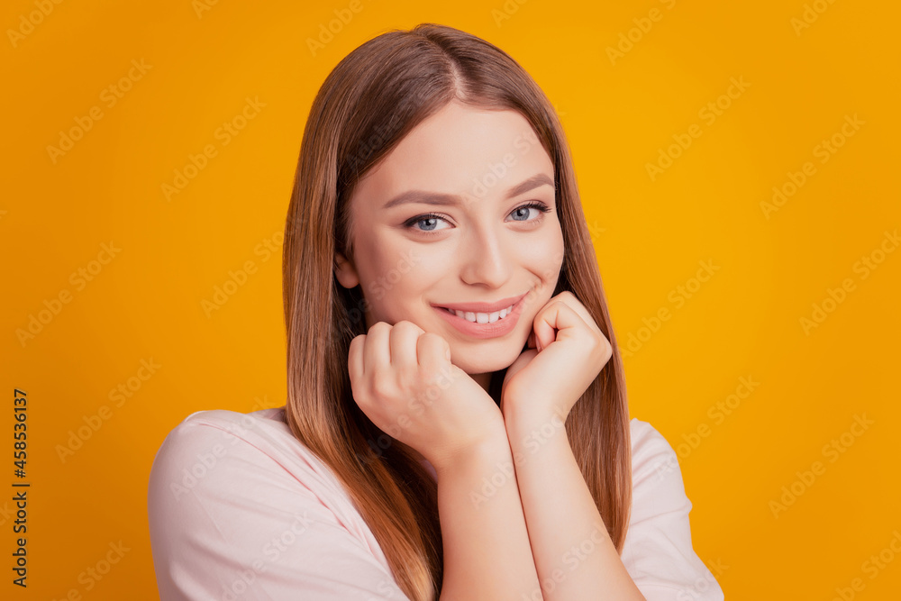 Portrait of lovely sweet dreamy lady hands cheeks look camera toothy smile on yellow background Portrait of lovely sweet dreamy lady hands cheeks look camera toothy smile on yellow background