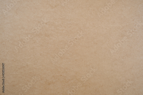 Fiberboard (MDF) surface. Recycled wood texture. Wooden surface of a fibreboard d sheet, top view. Brown hardboard texture background.