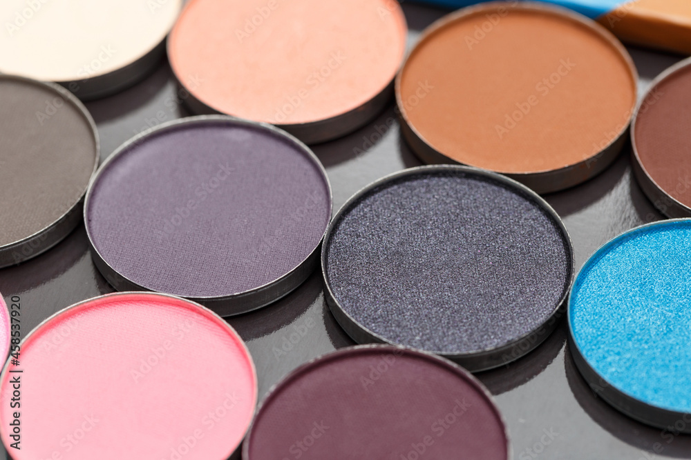 Close-up texture make-up eyeshadow palette. Abstract texture. Colorful colors. Highlighter. Professional make-up product. Flat lay. Macro photography. Set dry eyeshadow Close-up texture make-up eyeshadow palette. Abstract texture. Colorful colors. Highlighter. Professional make-up product. Flat lay. Macro photography. Set dry eyeshadow