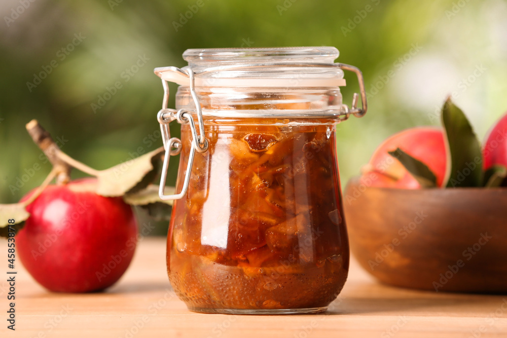 Delicious apple jam and fresh fruits on wooden table Delicious apple jam and fresh fruits on wooden table